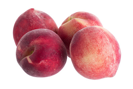 在白色背景上分离的新鲜桃子圆形黄色水果红色食物油桃高清图片