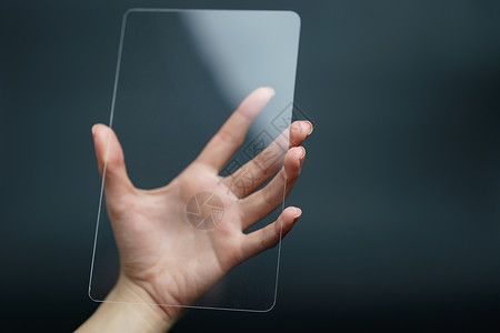 透明屏幕素材手持和显示透明平板设备 业务细胞工具创新屏幕身体电话玻璃电子商业触摸屏背景