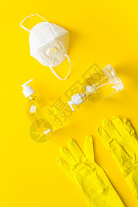 黄色案头顶视线上的手套 肥皂 面罩     冠状病毒预防背景图片
