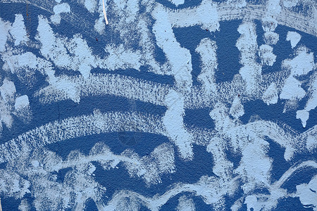 墙体涂鸦Grunge 蓝色混凝土墙体纹理背景上未完成的白色绘画石膏材料建筑艺术水泥房子墙纸涂鸦建筑学街道背景