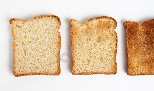 白面粉制成的面包平方正方块白色谷物早餐午餐粮食小吃营养食物黄色脆皮背景图片