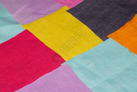 用于背景的彩色织物纺织品碎片正方形墙纸粉色蓝色下脚料橙子紫色分割黄色背景图片