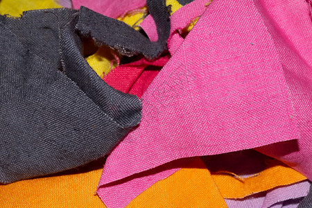 用于背景的彩色织物纺织品碎片蓝色墙纸粉色黄色分割正方形紫色橙子下脚料背景图片