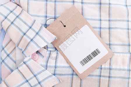粉红色按钮标签蓝色粉红色格子衬衫背景与价格 ta亚麻零售织物标签检查按钮服装衣服配饰购物背景