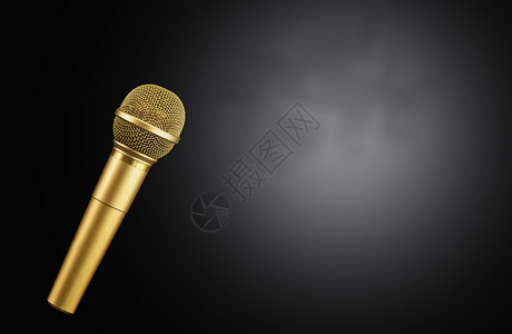 金麦克风素材黑色背景上的金色麦克风金属金子演讲广播歌曲唱歌乐器音乐记录说话背景