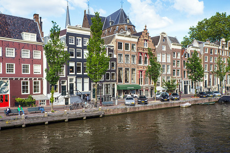 阿姆斯特丹的狭窄房屋房子首都文化街道特丹地标旅行景观城市场景背景图片