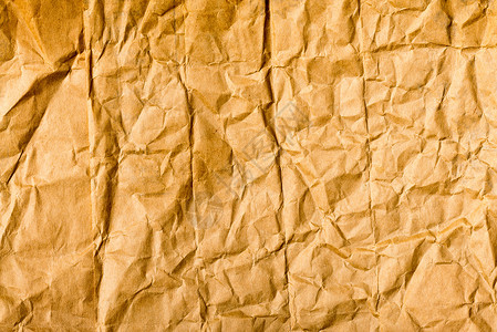 粉碎纸质折痕折叠羊皮纸材料床单棕色空白纸板背景图片