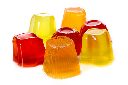 塑料杯中不同口味的果冻味道甜点柠檬红色橙子食物塑料杯子水果糕点背景图片