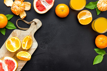 使用柑橘水果切割板 顶视图 复制空间柚子黄色柠檬红色砧板团体叶子热带绿色橙子背景图片