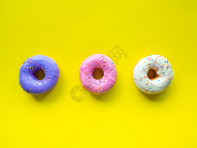 甜甜圈有颜色的橙色白紫粉 高能量食品和健康价格 甜甜糖 背景图画等橙子紫色口味费率粉色白色甜味背景图片