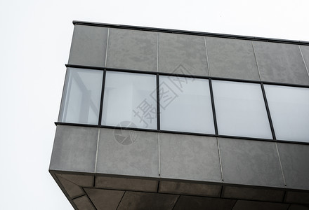带有空窗口的混凝土灰色建筑碎片石头城市墙壁角落公寓角度街道房子办公室建筑学背景图片