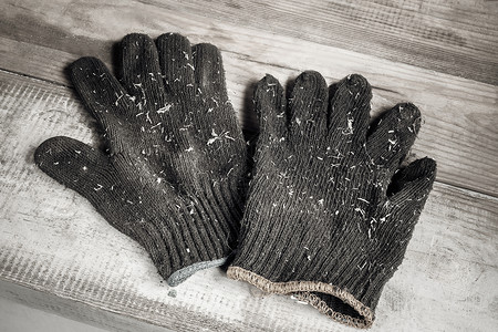 一双棉手套使用棉手套在工作时保护手安全障碍衣服危险材料配饰蓝色季节工人胡子背景