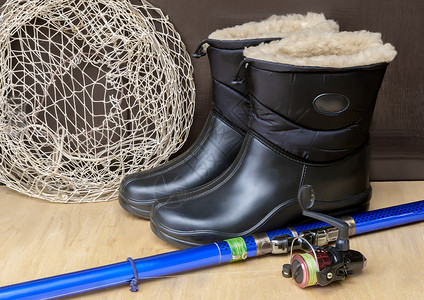 钓鱼鞋素材防水鞋和捕鱼用渔具背景