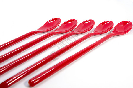 红色塑料勺子背景图片