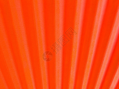 日式折叠手风扇橙子扇子手扇红色背景图片