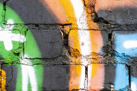 在砖墙纹理上涂鸦艺术品绘画建筑墙纸创造力街道艺术背景图片