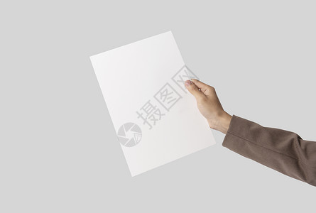 显示灰色背景的模型模板标识标志的空白纸A4传单 手印为灰色背景背景图片