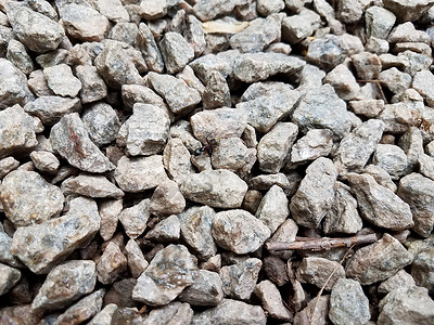 灰宝石或黑蚂蚁石昆虫地面鹅卵石灰色岩石黑色白色石头背景图片