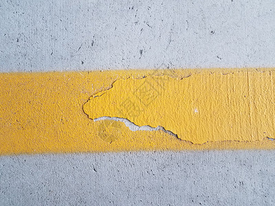 灰水泥表面黄色涂漆线路面灰色水泥地面背景图片