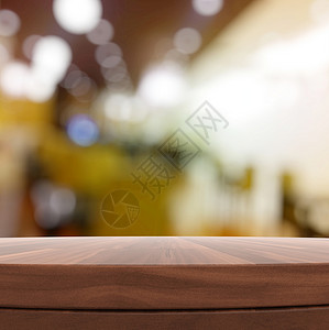 空木制圆桌和产品预产期的模糊背景商业阴影沙发店铺零售奢华推介会架子木板房间背景图片