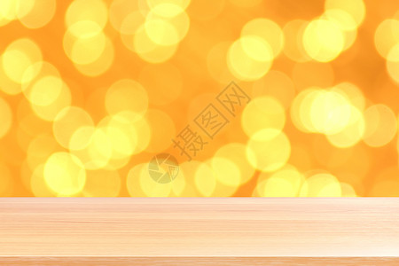 散景金黄色彩色背景上的木板 散景上的空木桌地板闪闪发光的浅金色奢华 木桌板空前闪闪发光的金色 散景照明上的木制闪闪发光的金色展示背景图片