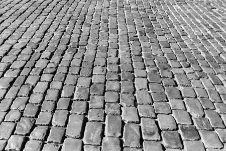 花岗岩纹理老路面小路人行道地面材料黑色白色鹅卵石岩石马赛克街道背景