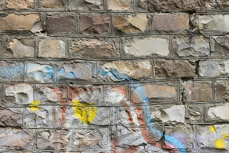 在砖墙纹理上涂鸦艺术建筑创造力绘画街道墙纸艺术品背景图片
