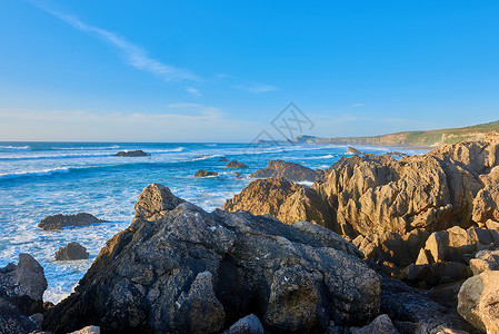 欧罗巴海滩的日落爬坡悬崖支撑公园海景海岸线岩石石头海浪海洋背景
