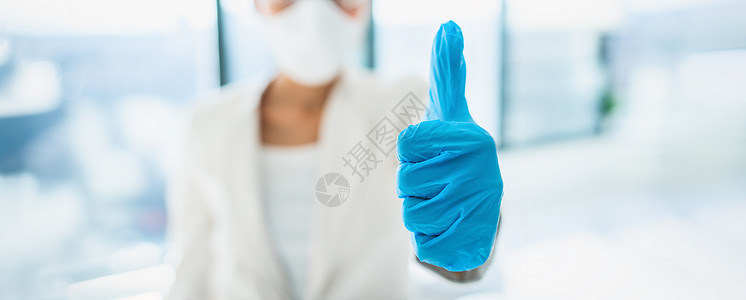 坚信抗疫成功Corona病毒 成功喜庆新闻实验室研究者 用抗疫苗的医疗手套做拇指 COVID-19保健横幅的PPE背景