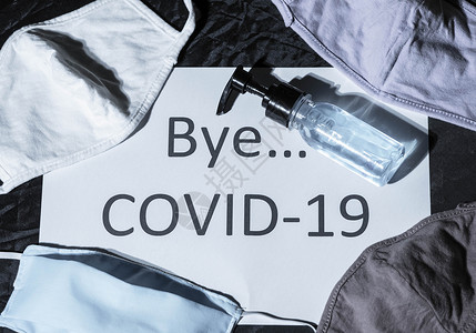 bye光照着贴有标签的纸 Bye COVID 19和防护F背景