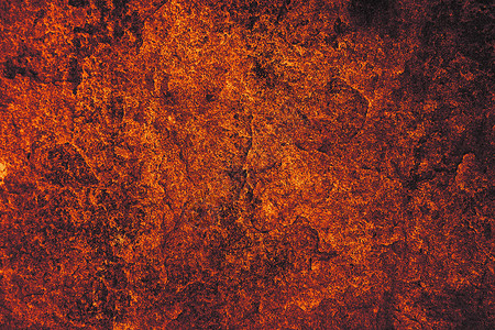 古老的深色熔岩花岗岩石表面的洞穴内部花纹地面床单花岗岩橙子石头侵蚀奢华艺术墙纸背景图片