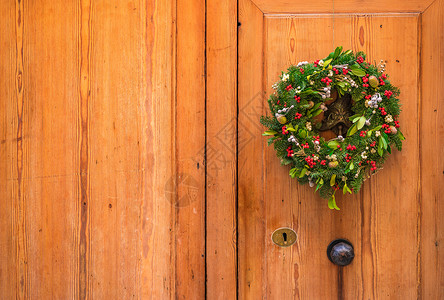 圣诞门环木门前门的门花圈背景