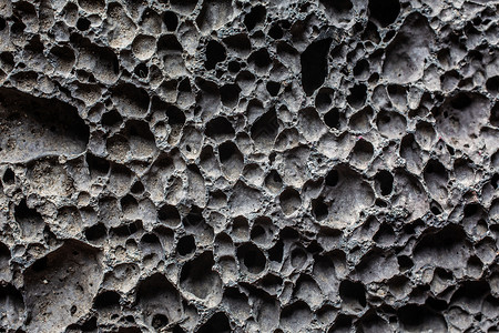 灰色多孔宝石作为火山发光岩石浮力毛孔海绵状火山岩矿物学浮石背景图片