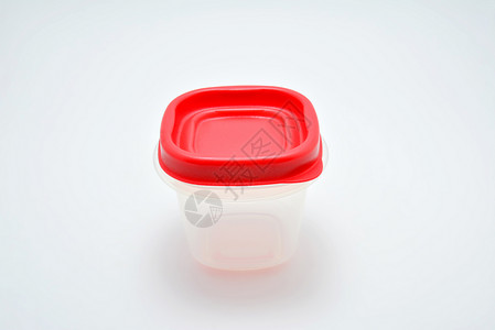 透明坚固固体塑料液态罐体厨房液体材料盘子店铺贮存红色食物背景图片