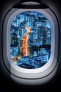 飞机窗户美丽的雅潘城景从飞机窗口喷射商业窗户椭圆形玻璃旅行舷窗椭圆建筑蓝色背景