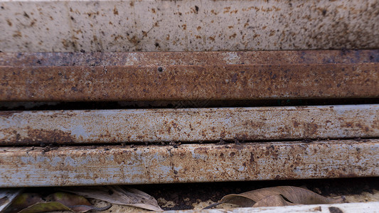 钢铁生锈棕色钢锈材料管道木板金属木材背景图片
