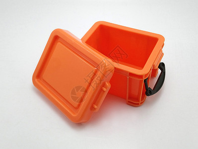 塑料盖子小塑料橙色储存箱 顶盖盖上盖子和锁住Si贮存橙子盒子背景