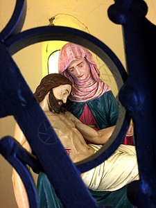 基督和玛丽 在网格后面高清图片