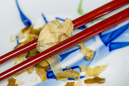 日式日本片片熏制胜男食物薄片健康库存大石粉末武士烹饪背景图片