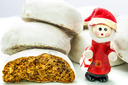 德国圣诞蛋糕Pfeffernus黑色商品熟食胡椒宏观面包白色坚果面团背景图片