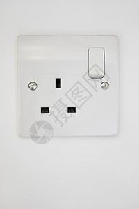 电源插在白墙上活力电子产品正方形静物几何电气插座开关技术概念背景图片