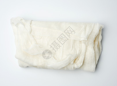 白色背景的折叠棉花白纱布织物背景图片