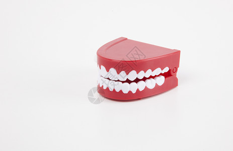 白色背景上方的人工假牙卫生牙齿生物学塑料保健影棚器材对象健康牙科背景图片