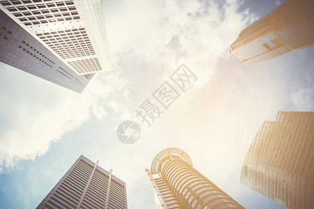 现代商业摩天大楼 高楼 建筑和建筑办公室银行企业酒店太阳天空城市蓝色市中心奢华背景图片
