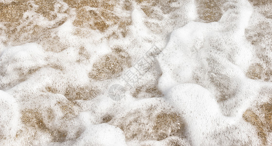 沙沙中的海洋泡沫背景图片