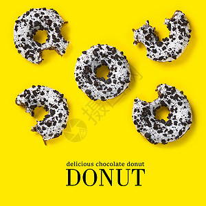 燃烧卡路里海报黄色背景上甜甜圈的创意组合 平躺着美味的巧克力甜甜圈和简单的文字背景