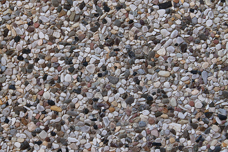 棕色鹅卵石海滩详细近视碎石和石块的碎石地花岗岩鹅卵石白色纹理食物种子建造灰色大理石岩石背景