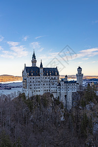 路德维希二世冬季清晨著名的纽施旺斯坦城堡的景色旅行仙境历史纪念碑建筑学遗产吸引力历史性观光国王背景