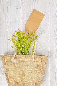 森伯斯特包印有礼品标签的黑森购物袋妈妈们花朵叶子高架花瓣礼物程式化浪漫木材问候语背景