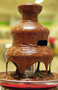 黑色巧克力喷泉火锅黄色宏观派对饮食牛奶婚礼人类棕色水果背景图片